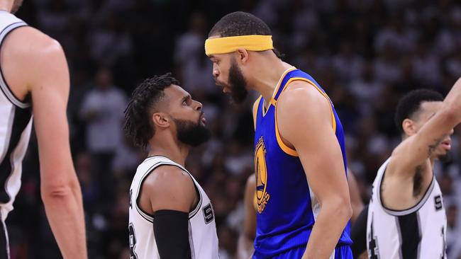 JaVale McGee of the Golden State Warriors exchanges words with Patty Mills of the San Antonio Spurs in the first half during Game Three of the 2017 NBA Western Conference Finals in San Antonio, Texas. Picture: Ronald Martinez/Getty Images/AFP