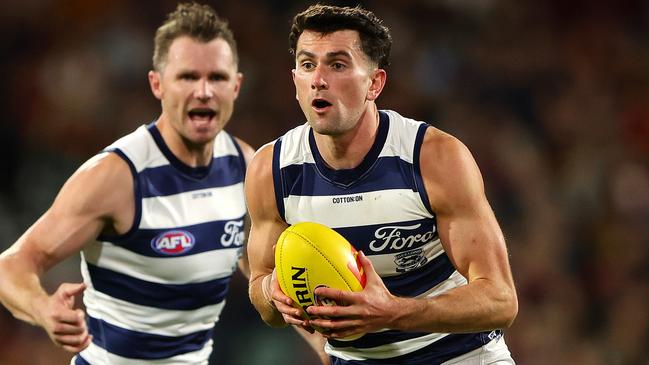 ADELAIDE, AUSTRALIA - MARCH 22: Mark O'Connor of the Cats and Patrick Dangerfield during the 2024 AFL Round 2 match between the Adelaide Crows and the Geelong Cats at Adelaide Oval on March 22, 2024 in Adelaide, Australia. (Photo by Sarah Reed/AFL Photos via Getty Images)