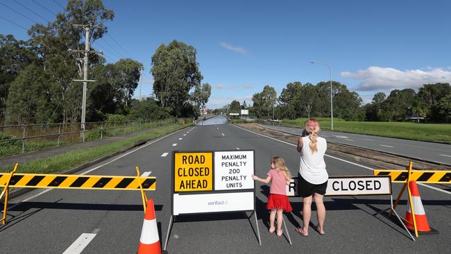 Police are warning flood spectators to stay out of closed roads. The Larry Storey Bridge at Waterford West is cut off by flood waters higher than 2017. Picture: NIGEL HALLETT