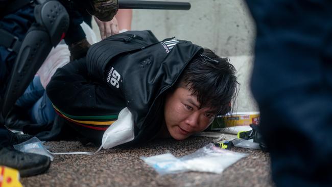 A defiant rallyer is arrested by police officer during a protest on June 12, 2019 in Hong Kong China.