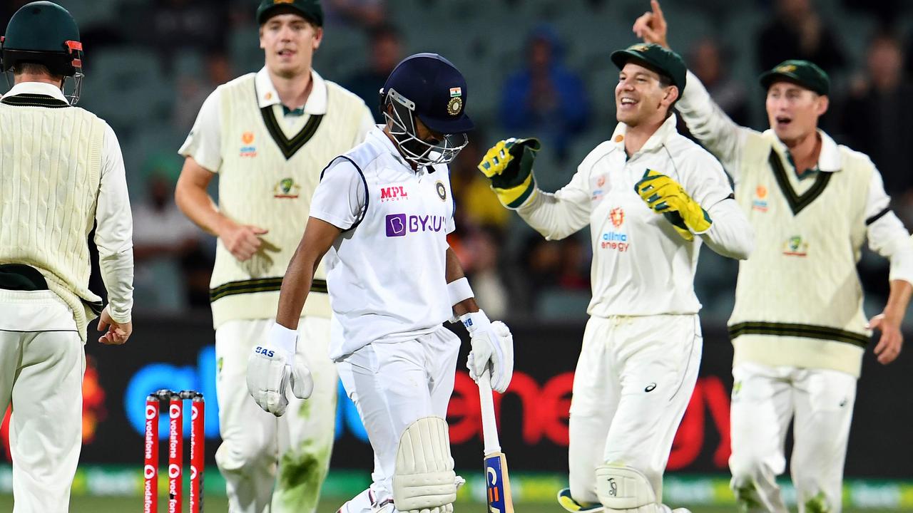 Australia's players celebrate the dismissal of India's badsman Ajinkya Rahane.