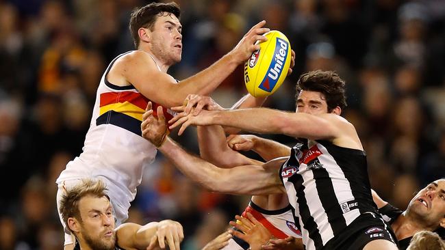 Mitch McGovern takes a spectacular high mark before sealing a draw for the Crows against the Magpies. Picture: Getty Images