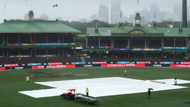 Heavy rain falls over the SCG forcing the cancellation of the World Cup semi-final between England and India. Picture: Getty Images