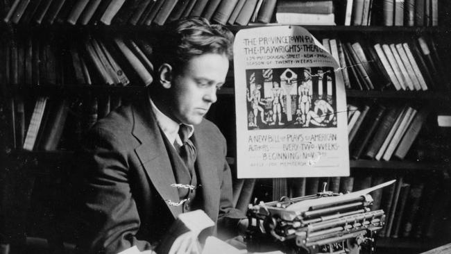 American journalist and socialist activist John Reed at his desk.