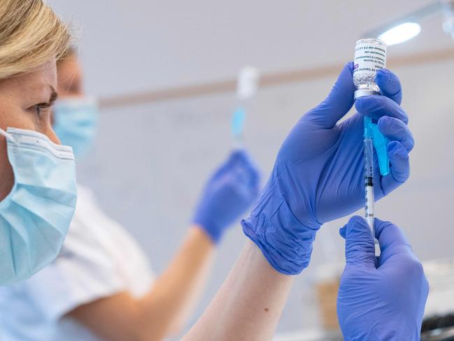 Syringes are loaded with the AstraZeneca Covid-19 Vaccine at the Skane University Hospital vaccination centre in Malmo, Sweden, on February 17, 2021. (Photo by Johan NILSSON / TT NEWS AGENCY / AFP) / Sweden OUT