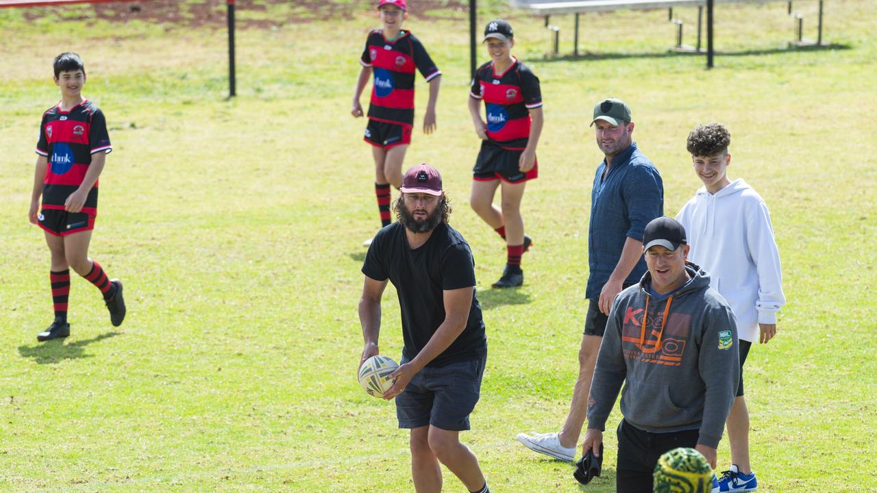 Some of the Walker brothers with Valleys juniors during a break in play last year. Picture: Kevin Farmer