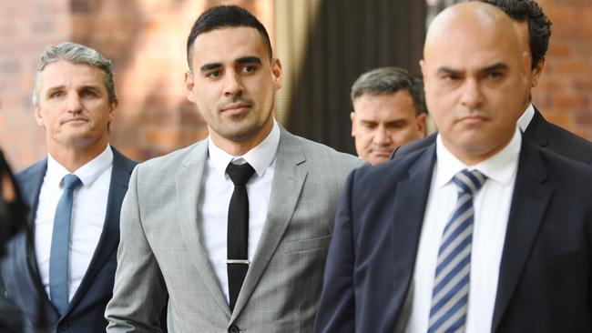 Tyrone May (centre) leaves Parramatta Local Court on Friday, supported by Penrith Panthers coach Ivan Cleary (left). Picture: AAP Image/Dean Lewins