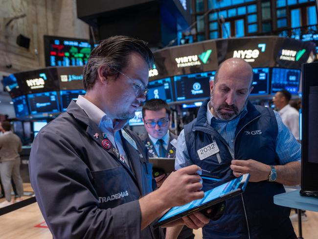 NEW YORK, NEW YORK - NOVEMBER 12: Traders work on the New York Stock Exchange (NYSE) floor on November 12, 2024 in New York City. After closing at record highs yesterday, the Dow was down slightly in morning trading.   Spencer Platt/Getty Images/AFP (Photo by SPENCER PLATT / GETTY IMAGES NORTH AMERICA / Getty Images via AFP)