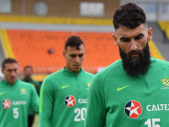 Australian captain Mile Jedinak (right) will start the match. Pic: AAP