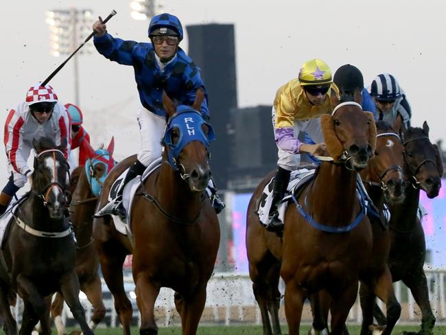 Damian Browne celebrates as Buffering wins the Al-Quoz Sprint. Picture: AFP