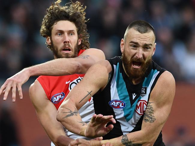 Charlie Dixon wrestles with Tom Hickey against the Swans. Picture: Getty Images