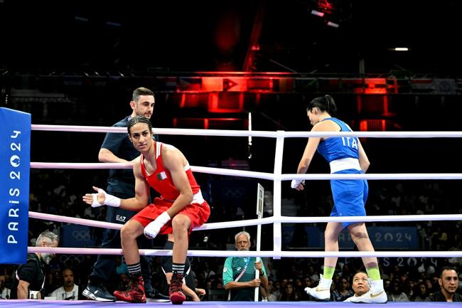 Algeria's Imane Khelif (in red) was given a huge roar on arrival at the Paris arena