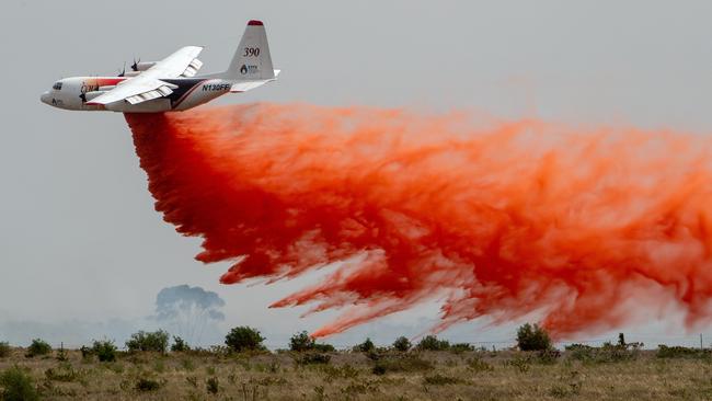 An aircraft drops fire retardant on the Little River grassfire. Picture: Jay Town