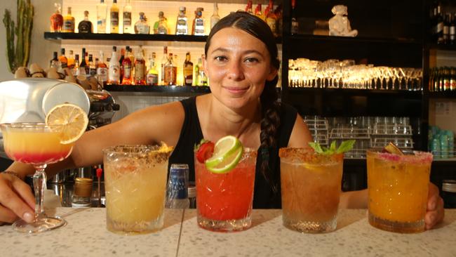 Bartender Pamela Arciniega with drinks. Picture Glenn Hampson