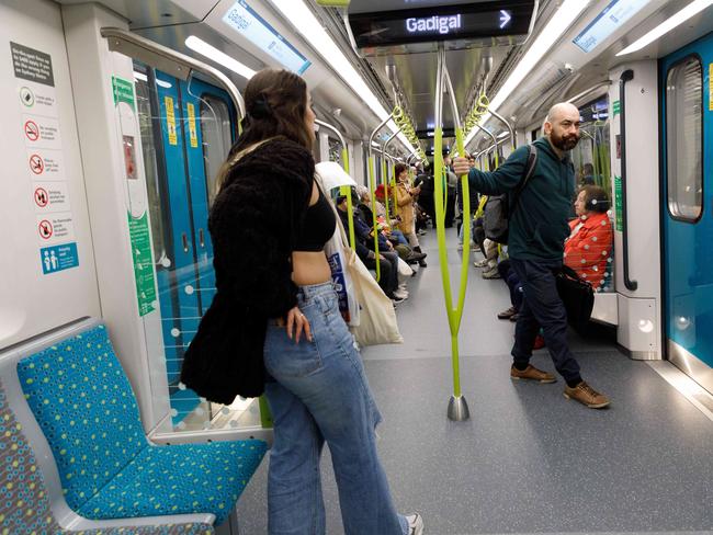 SYDNEY, AUSTRALIA - NewsWire Photos. August 19 2024. Commuters ride a metro train on the opening day of the Sydney Metro. Picture: NewsWire / Max Mason-Hubers