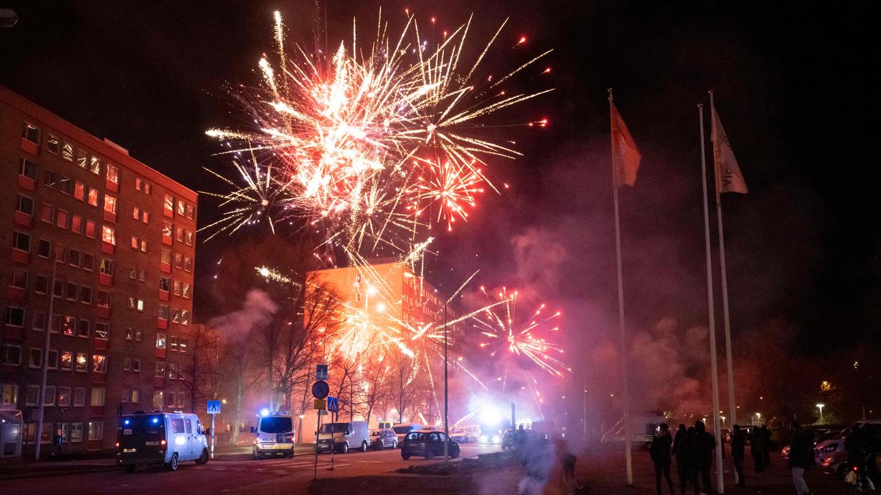 Fireworks are set off during a late night protest in Malmo. Photo by Johan NILSSON / TT NEWS AGENCY / AFP)