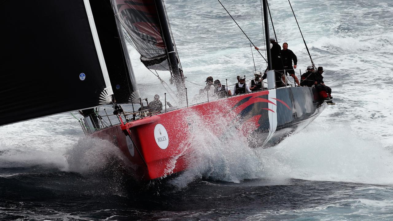 Comanche leads the super maxis to the seaward mark outside Sydney Heads during Day 1 of the 2015 Sydney Hobart Yacht Race. Pic Brett Costello