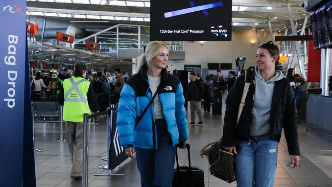 Jamie Mayberry and Lily-Jane Burchett are seen among the chaos at Sydney Domestic Airport (T2) on Monday. Picture: NCA Newswire