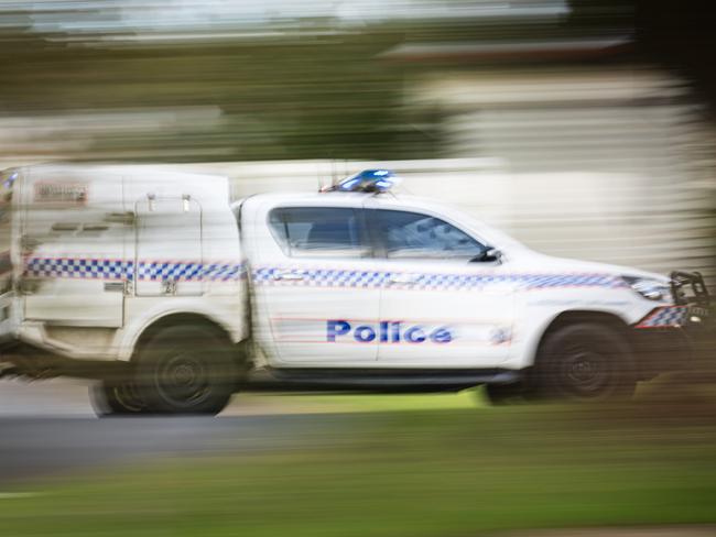 A police vehicle under lights and sirens on Ruthven St in Toowoomba, Wednesday, April 24, 2024. generic Queensland Police, QPS, police Picture: Kevin Farmer