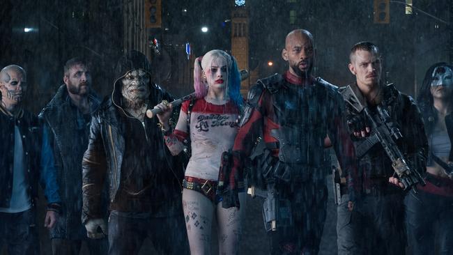 Margot Robbie as Harley Quinn with her co-stars in Suicide Squad.