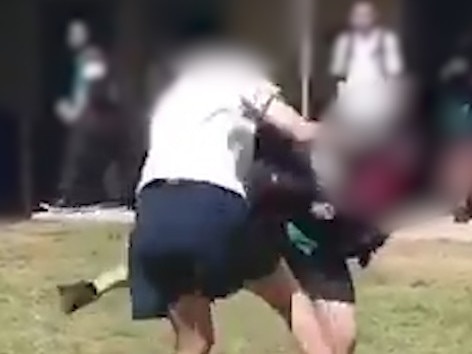 Screen grabs from school-yard fight caught on video.