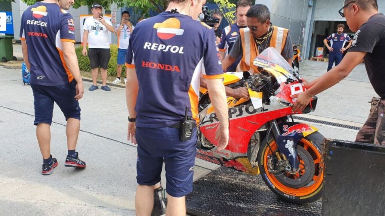 Honda mechanics retrieve Marc Marquez's damaged Honda. Pic: GPOne.com