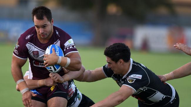 Burleigh’s Hayden Schwass is tackled in his side’s Intrust Super Cup trial match against Tweed Heads at Burleigh’s junior fields. Picture: Steve Holland