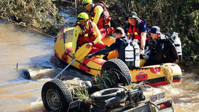 Queensland Police Divers and Queensland Fire Swift Water Rescue Team members were involved in the recovery. Picture: Scott Powick/NCA NewsWire