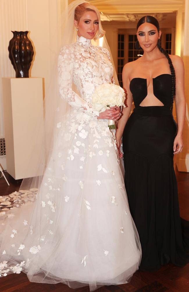 Kim Kardashian plunging dress at Paris Hilton wedding Daily Telegraph