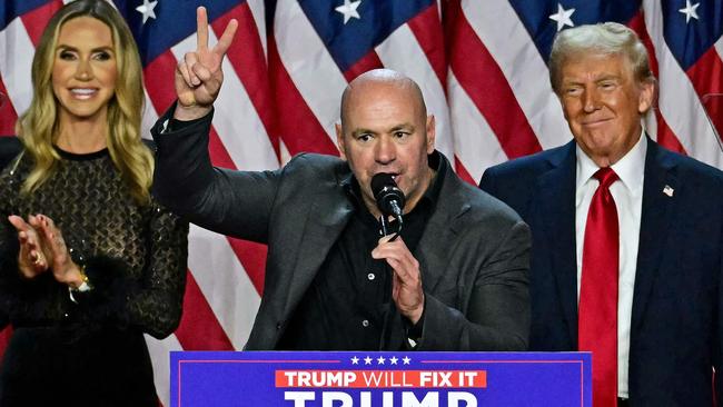 UFC boss Dana White, flanked by Donald Trump and his daughter-in-law Lara Trump, at the President-elect’s victory event on election night. Picture: Jim Watson/AFP