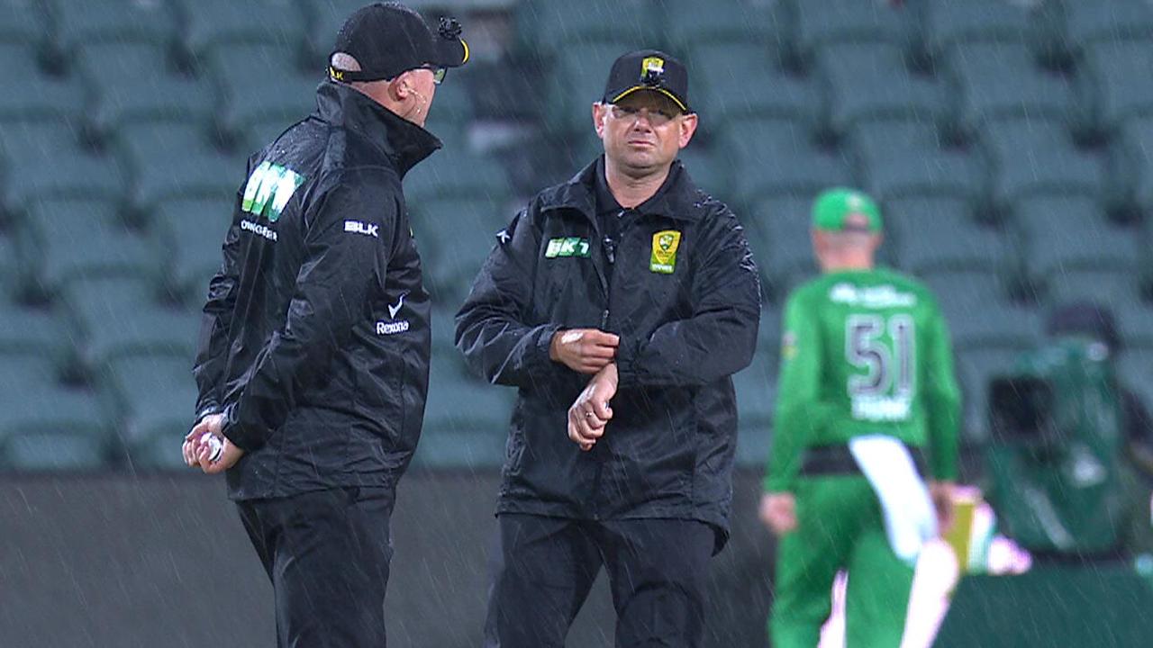 Umpires call a stop to play for bad weather in Launceston.
