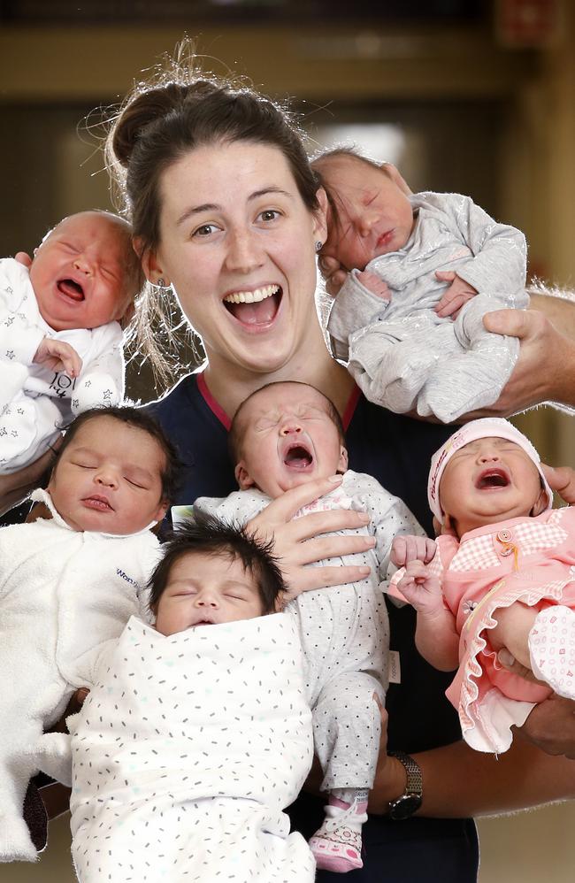 Sunshine Hospital midwife Nicole Peterson and newborns Lily, Amir, Siya, Selma, Eden and Sabiha. Picture: David Caird