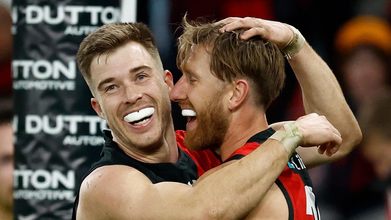 MELBOURNE, AUSTRALIA - JUNE 23: Zach Merrett (left) and Dyson Heppell of the Bombers celebrate during the 2024 AFL Round 15 match between the Essendon Bombers and the West Coast Eagles at Marvel Stadium on June 23, 2024 in Melbourne, Australia. (Photo by Michael Willson/AFL Photos via Getty Images)