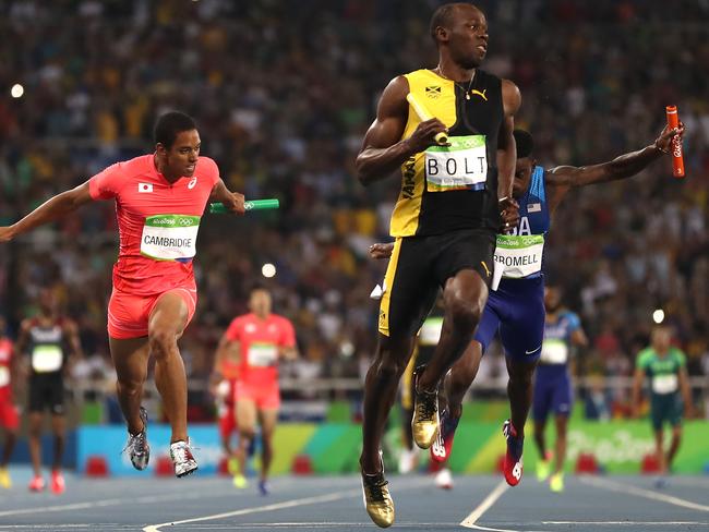 Usain Bolt of Jamaica crosses the finish line to win the Men's 4x100m relay.