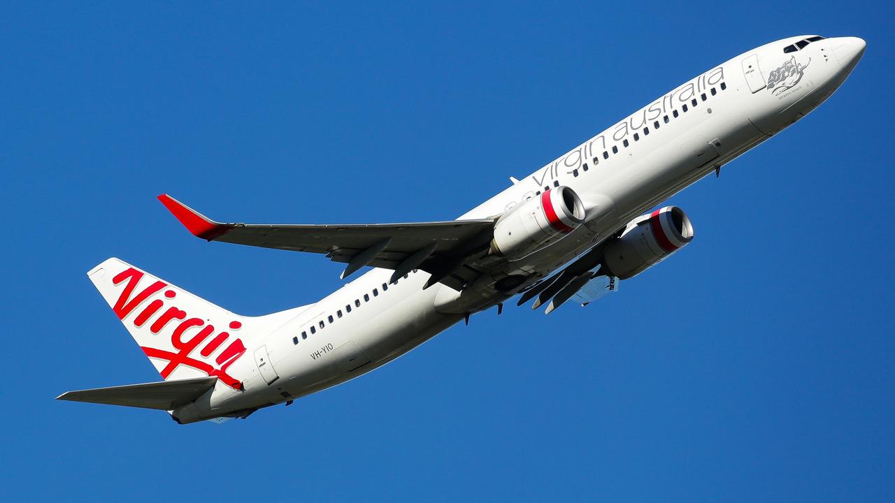 SYDNEY, AUSTRALIA - NewsWire Photos MARCH 24, 2021: An Aerial view of a Virgin Plane taking off from the Domestic Airport in Sydney Australia. Picture: NCA NewsWire / Gaye Gerard