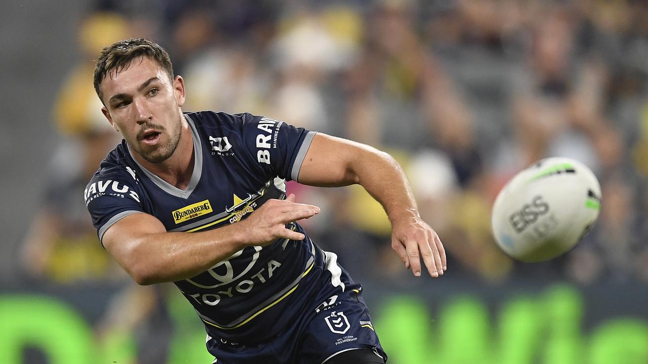 TOWNSVILLE, AUSTRALIA - JUNE 18: Reece Robson of the Cowboys passes the ball during the round 15 NRL match between the North Queensland Cowboys and the Cronulla Sharks at QCB Stadium, on June 18, 2021, in Townsville, Australia. (Photo by Ian Hitchcock/Getty Images)