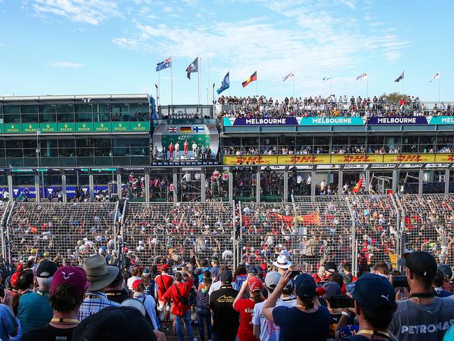 2017 Australian Grand Prix at Albert Park , Melbourne , Australia. Fans applaud Lewis Hamilton who placed 2nd , winner Sebastian Vettel and 3rd placegetter Valterri Bottas . Picture : Ian Currie