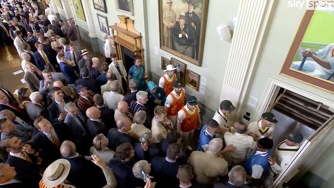 Usman Khawaja and Dave Warner in dispute with several MCC Members in the Long Room at Lords during the lunch break.