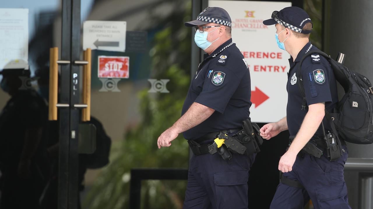 Police enter the hotel. Photo: Tara Croser.