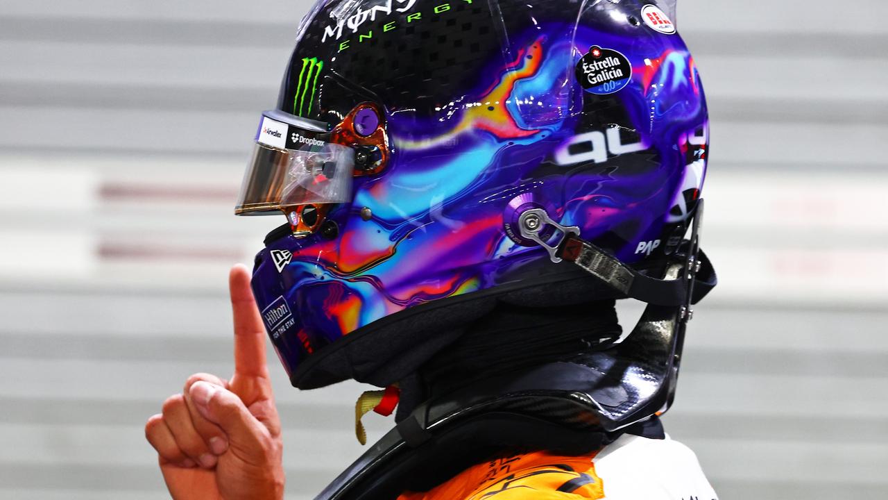 SINGAPORE, SINGAPORE - SEPTEMBER 21: Pole position qualifier Lando Norris of Great Britain and McLaren celebrates in parc ferme during qualifying ahead of the F1 Grand Prix of Singapore at Marina Bay Street Circuit on September 21, 2024 in Singapore, Singapore. (Photo by Mark Thompson/Getty Images)