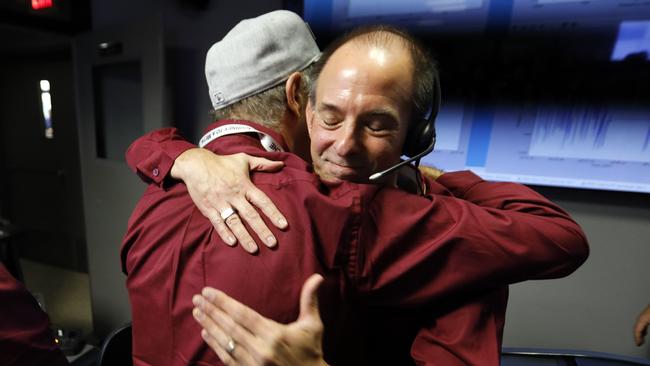 Engineers embrace after the Mars landing of Insight. Picture: AP