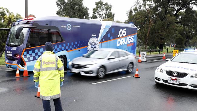 Victoria Police set up a check point on Sydney Road, Fawkner as part of the suburb’s locked down status