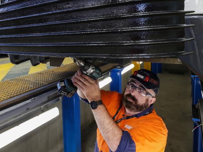 Pat Byrnes working on a tram at the Yarra Trams. Picture: NCA NewsWire / Ian Currie