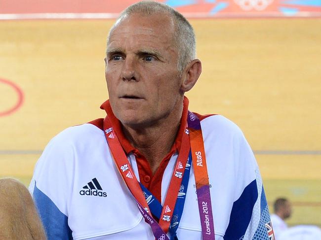 (FILES) This file photo taken on August 5, 2012 shows Shane Sutton, observing a race in the London 2012 Olympic Games men's omnium 1km time trial cycling event, at the Velodrome in the Olympic Park in east London. Shane Sutton resigned on April 27, 2016 as technical director of British Cycling following allegations he had used sexist and discriminatory language towards team riders. / AFP PHOTO / CARL DE SOUZA
