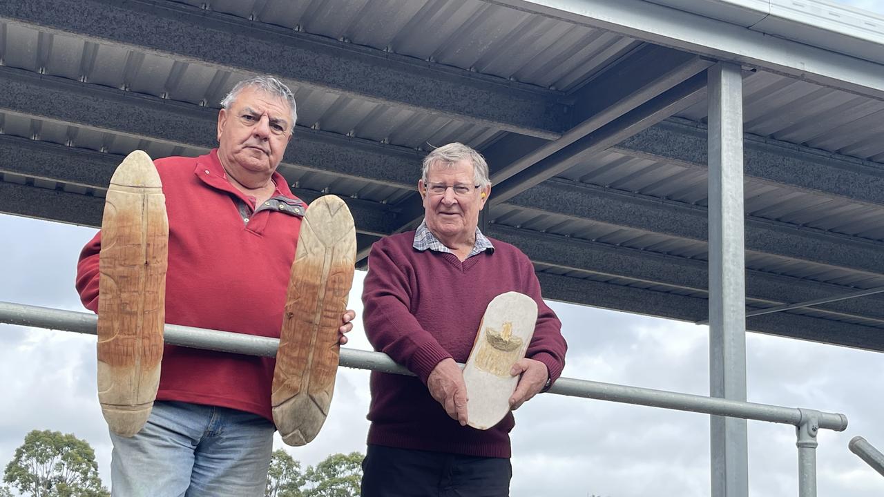 Butchulla elder Glen Miller with David Moon and the shields with fresh bullet holes in them.