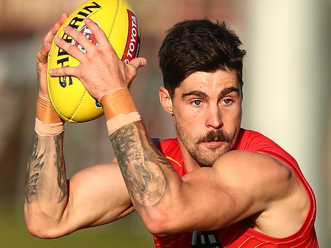 GOLD COAST, AUSTRALIA - JULY 22: Alex Sexton kicks during a Gold Coast Suns AFL training session at Austoworld Centre on July 22, 2021 in Gold Coast, Australia. (Photo by Chris Hyde/Getty Images)