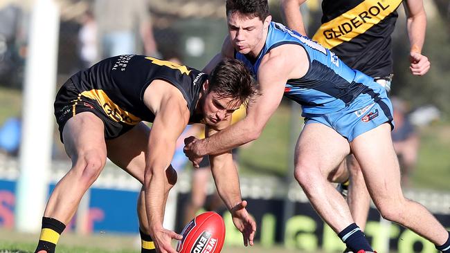 Glenelg’s Jackson Edwards and Sturt's Jed McEntee battle. Picture: Sarah Reed