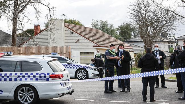 Police outside the Springfield Rd home on Monday. Picture: Jason Edwards