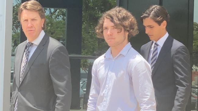 Jac Michael Webb (white shirt) leaves court with his lawyer Jason Jacobson, of Jacobson Mahony Lawyers (right).