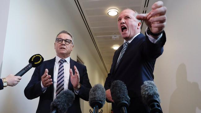 Joel Fitzgibbon and Barnaby Joyce during an impromptu debate in the Canberra press gallery corridor on Monday. Picture: ABC